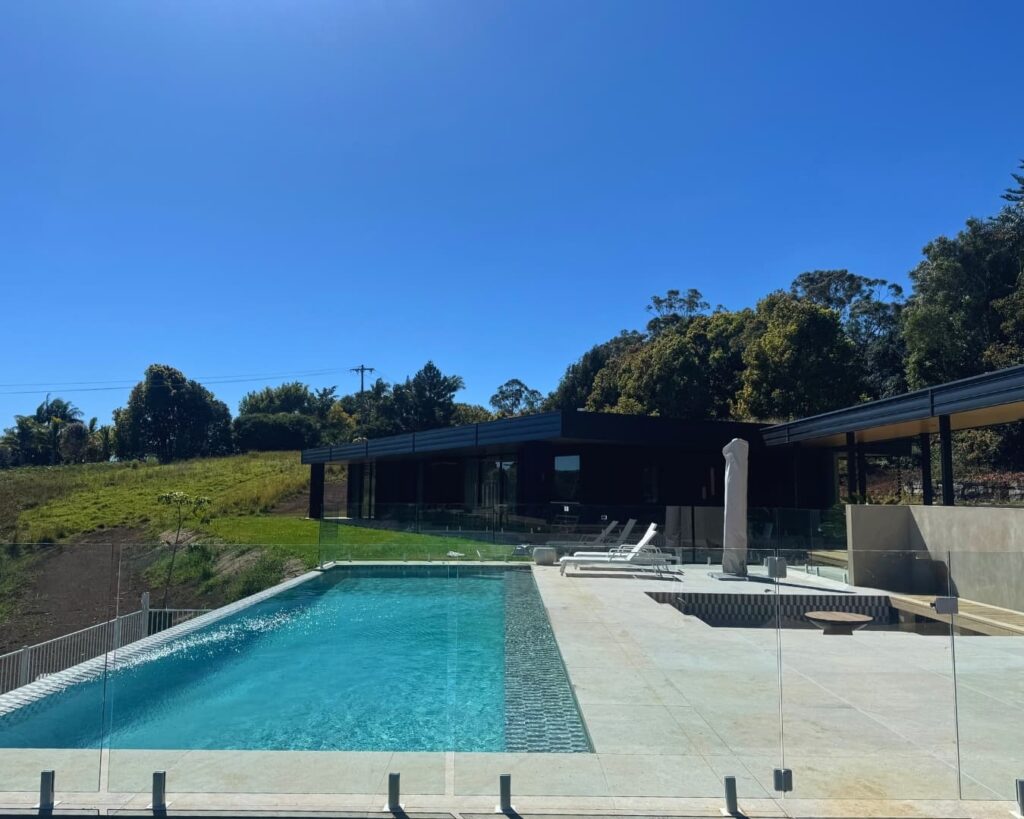 Elevated lap-style pool in the Northern Rivers hinterland overlooking rolling hills and open landscape